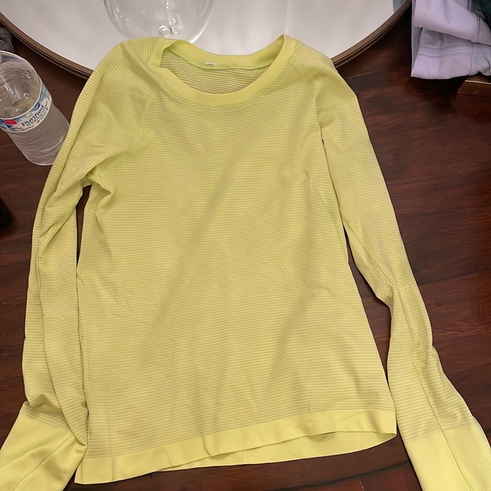 Swiftly tech long sleeve 2.0 race length. size 4. Color is neon yellow